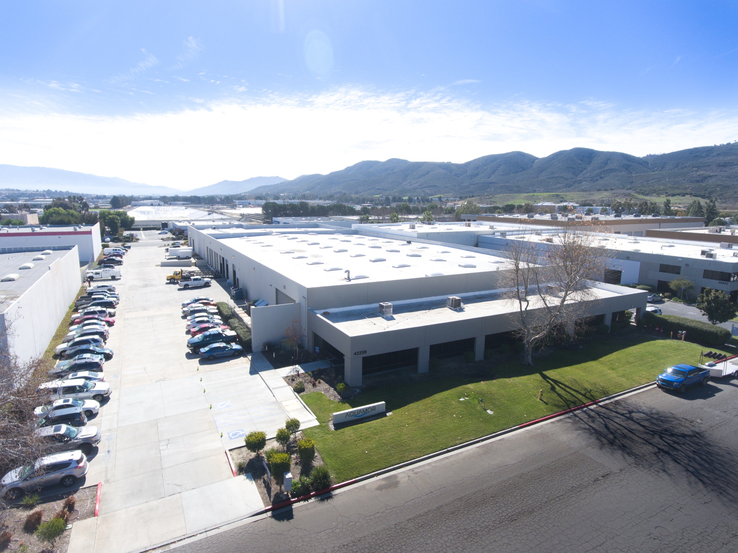 Aerial view of Aquamor's Temecula manufacturing facility with the Aquamor-branded building and surrounding grounds